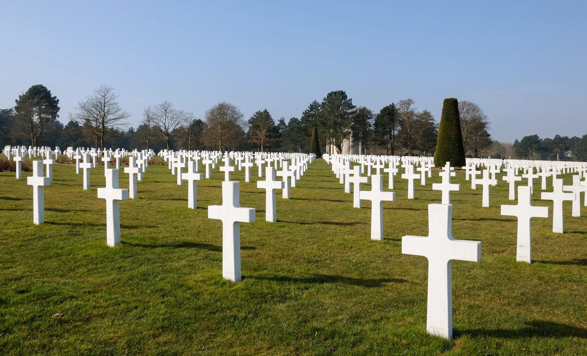 Rows of white marble headstones at the Normandy American Cemetery above Omaha Beach, Colleville-sur-Mer